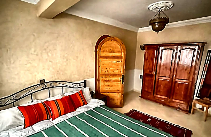 Atlas Cedar Double Suite with carved arch door and vintage wardrobe