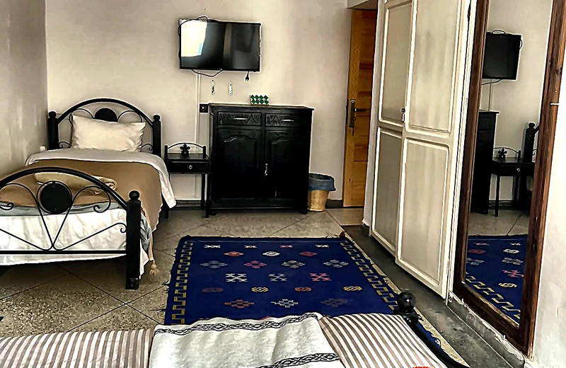 Shared Twin / Triple Artisan Room with wrought iron single beds
